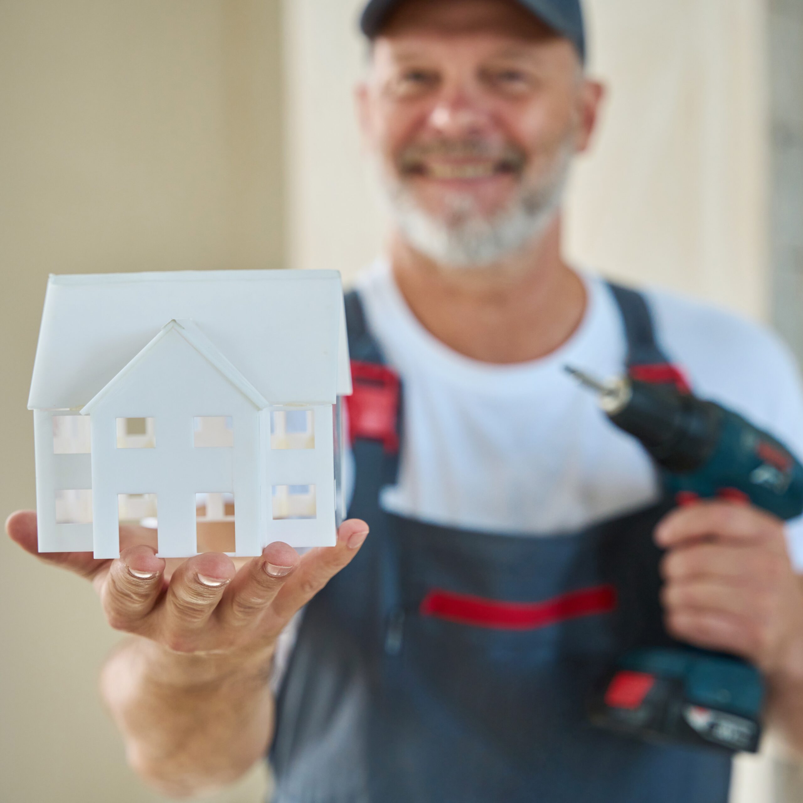 photo of smiling construction worker holding house 2025 03 05 23 06 36 utcp scaled